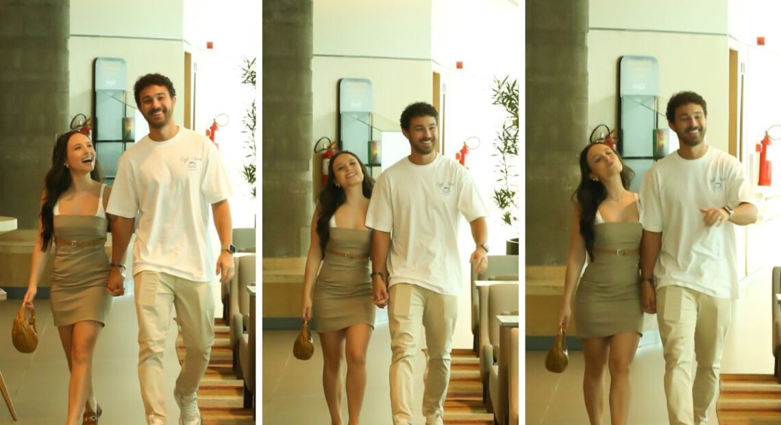 Larissa Manoela e André Luiz Frambach passeiam de mãos dadas em shopping